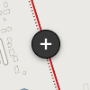 Round black circle with a white plus icon in the center